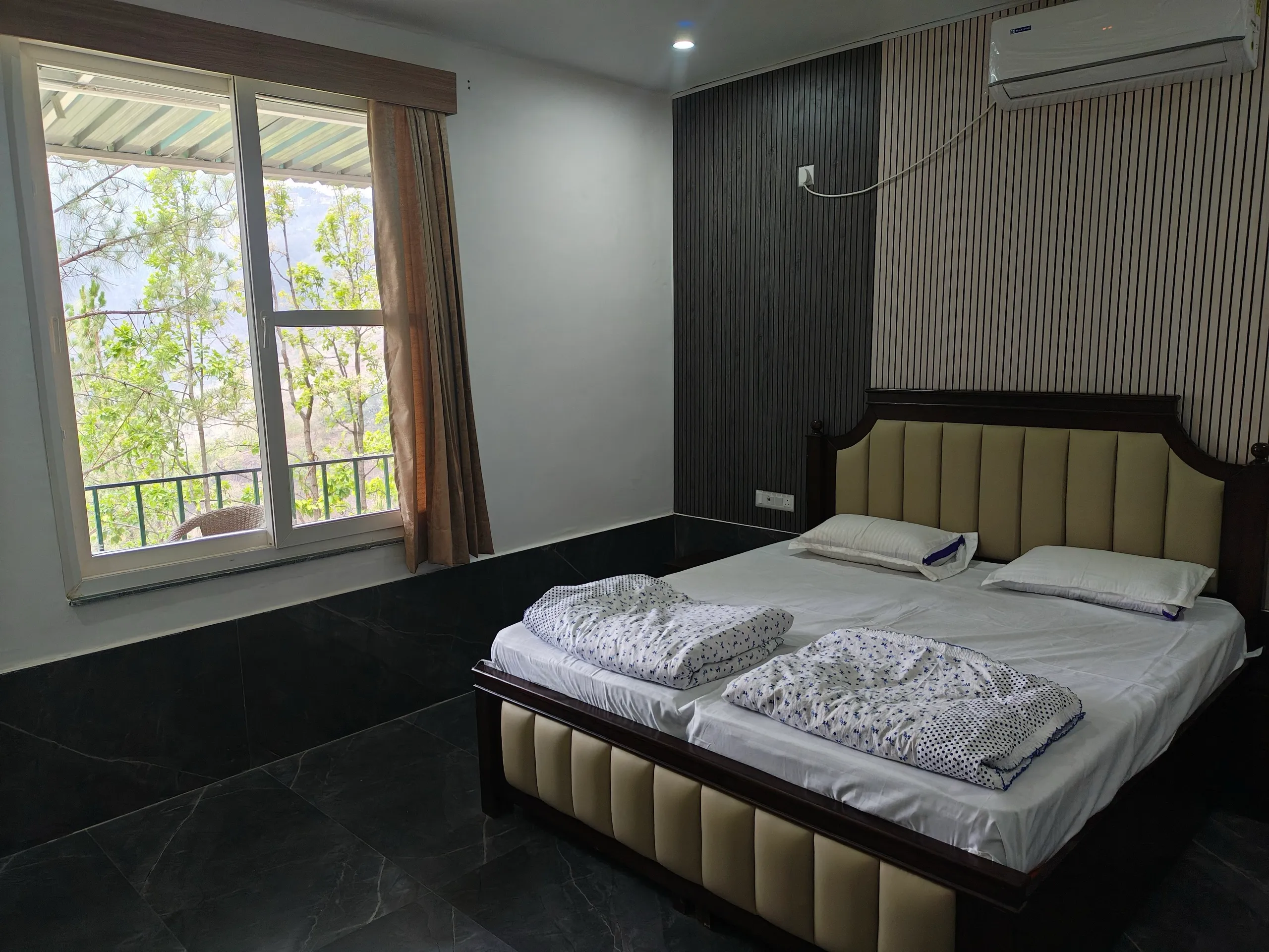 Master bedroom with king bed and mountain view window