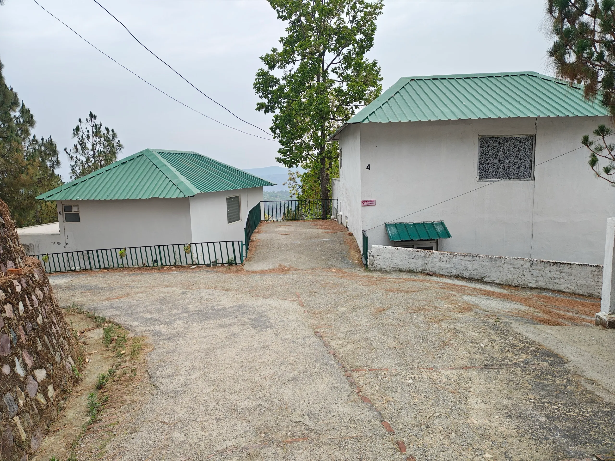 Exterior of two cottages with green roofs