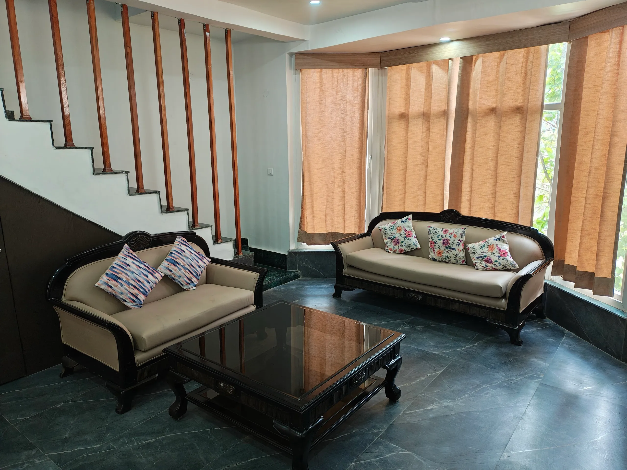Living room with two cane-frame sofas and coffee table