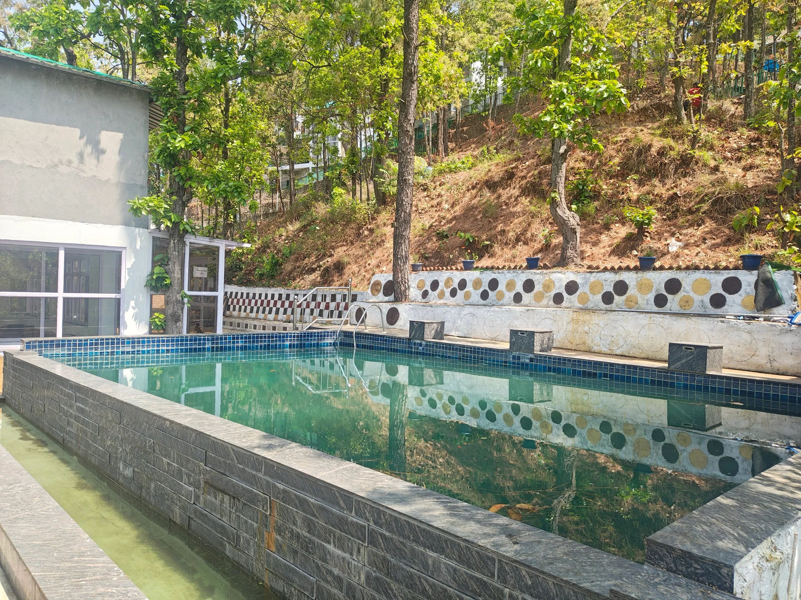 Side view of the resort pool with mountain backdrop